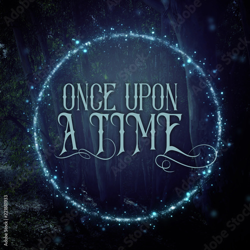 mysterious fairy tale background of dark and haunted forest and magical lights with text.