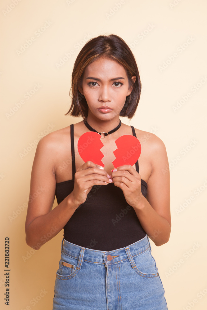 Beautiful young Asian woman with broken heart. Beautiful young Asian woman with broken heart.
