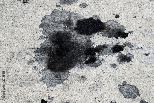 Motor oil stains on concrete pavement/texture background