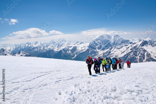 A group of tourists goes to conquer the summit