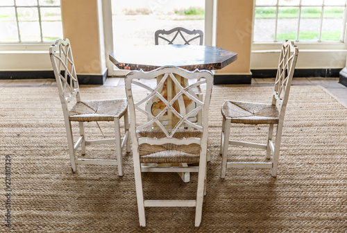 View of four beautiful vintage chairs around a small table