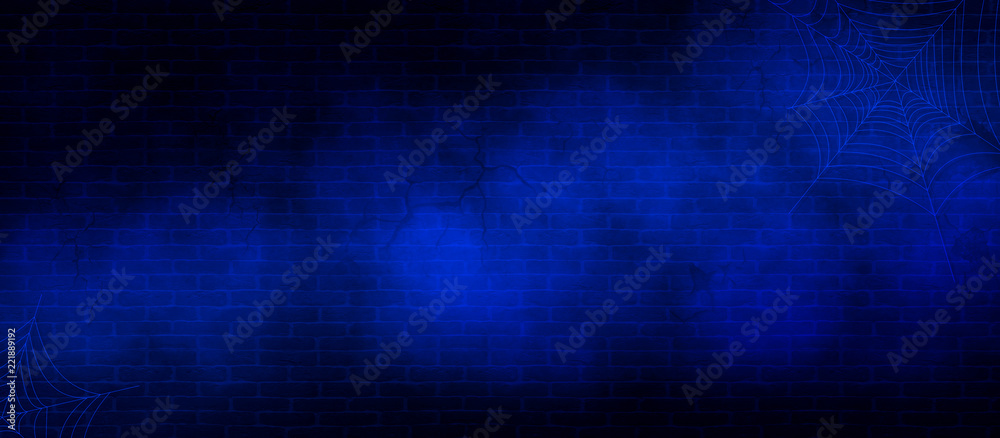 Blue brick wall background in cracks, with smoke, spider web