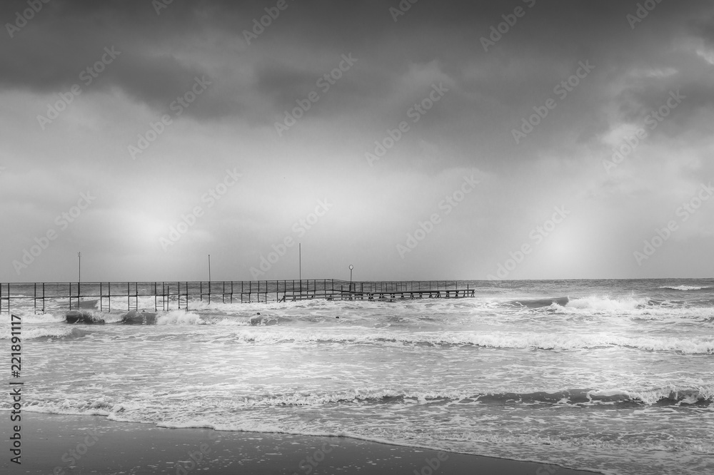 black and white beach on a bad weather day