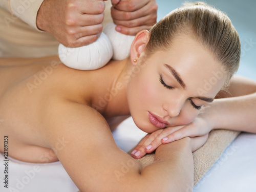 Woman getting  massage with hot stones