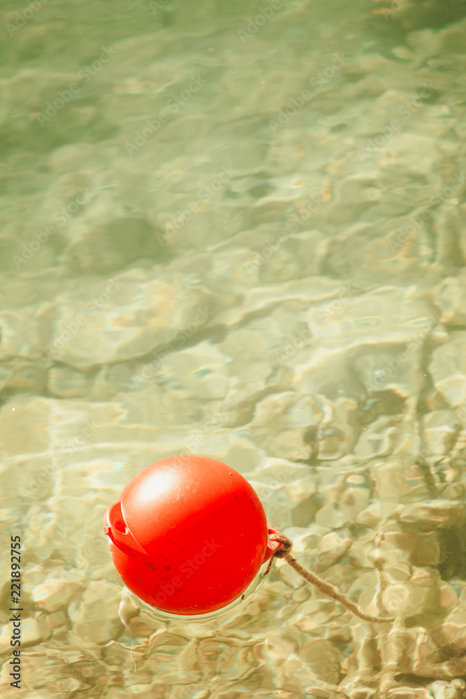 One red ball buoy