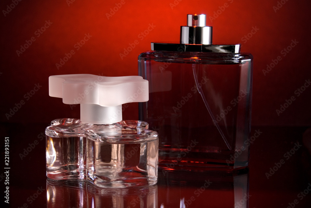 Various Glass Bottles with Red Lighted Background