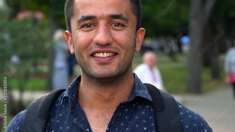 Portrait of a young Arab smiling man