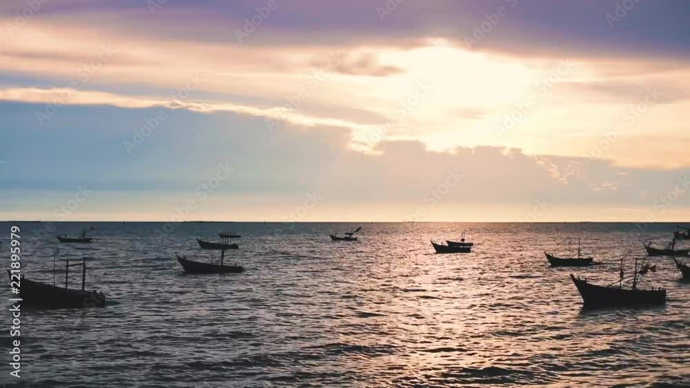 Silhouette fishing boat float on the sea at town port . footage HD Silhouette fishing boat float on the sea at town port . footage HD