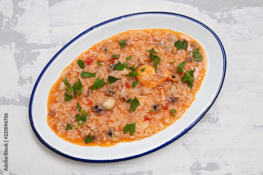 rice with seafood on white dish