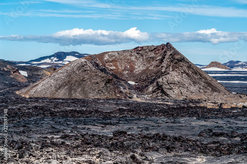 Krafla Lava Fields - Iceland. Itis located in Leirhnjukur, a few hundred meters down from Viti Crater, are a wide area of sulfur vapors and still hot volcanic lavas. photo