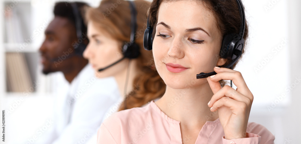 Call center operator.Young beautiful brunette woman in headset. Business concept Call center operator.Young beautiful brunette woman in headset. Business concept