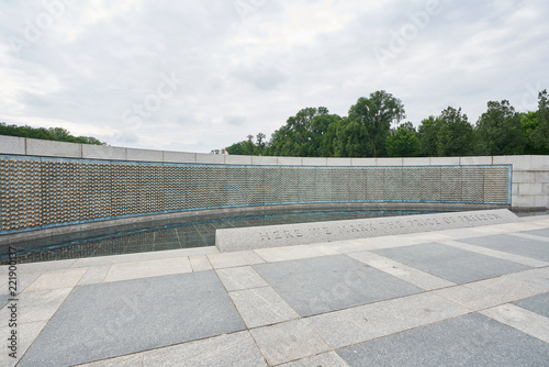 Fototapeta Naklejka Na Ścianę i Meble -  The Freedom Wall is on the west side of the memorial, with a view of the Reflecting Pool and Lincoln Memorial behind it. The wall has 4,048 gold stars, each representing 100 Americans who died in the 