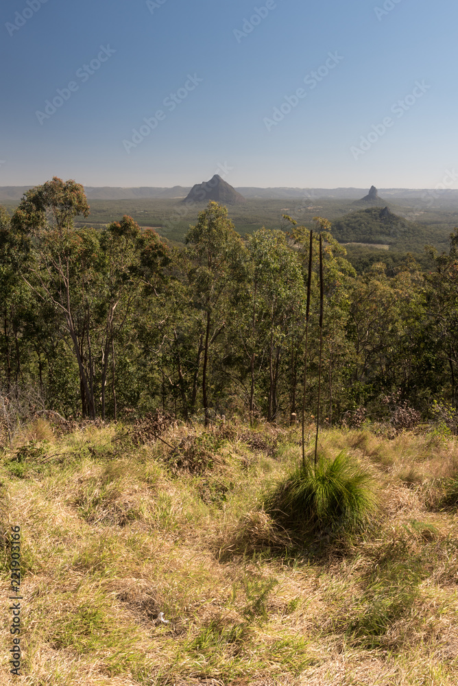 Fototapeta premium View of the Mts Coonowrin and Beerwah, two of the Glasshouse Mountains, from Mt Beerburrum lookout, Queensland, Australia.