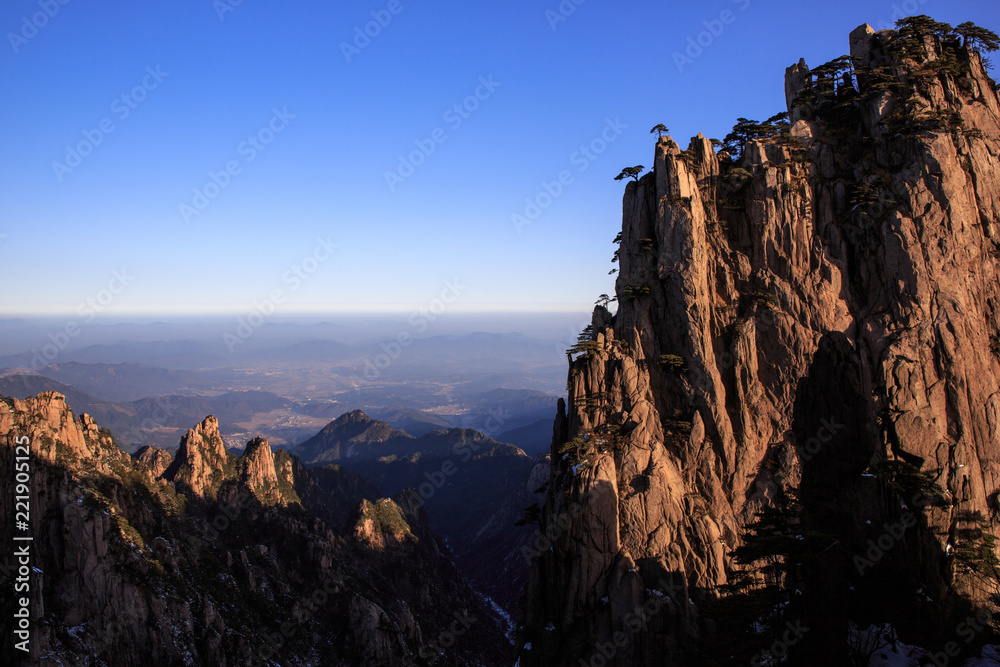 Obraz premium Huangshan China National Park - Anhui Province, Chinese Mountain Peak. Sea of Fog, Yellow Granite Mountains with Canyon, Exotic Pine Trees and Forest, Jagged Cliffs, UNESCO World Heritage Site