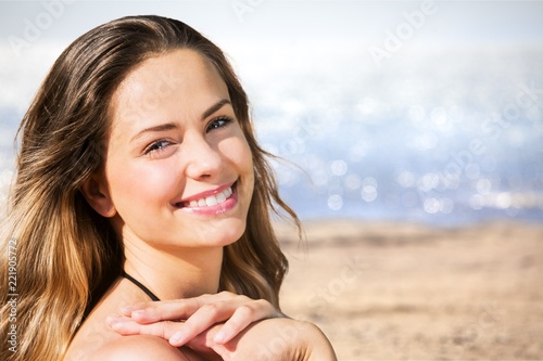 Photography Portrait of pretty young woman on sea background