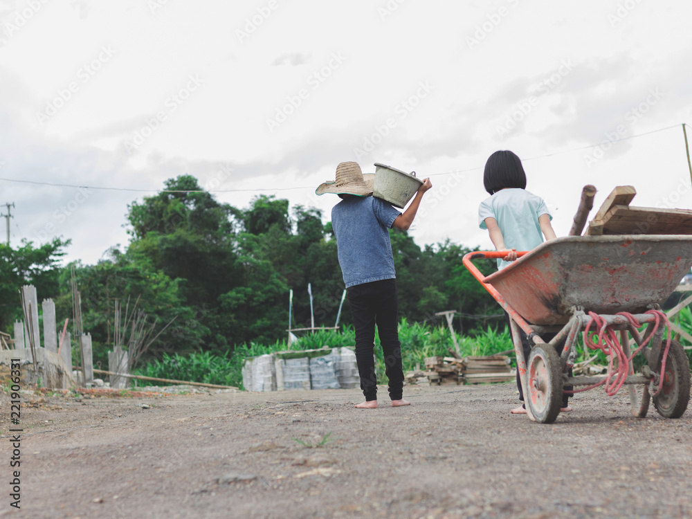 Obraz premium Children working at construction site for world day against children labour concept: