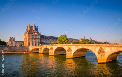 Sunset view on bridge and buildings on the Seine river in Paris, France