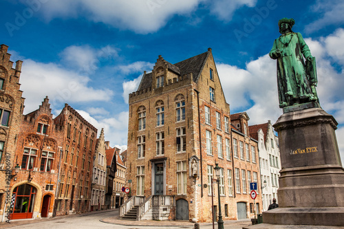 Statue of the painter Jan Van Eyck at the historical town of Bruges in Belgium photo