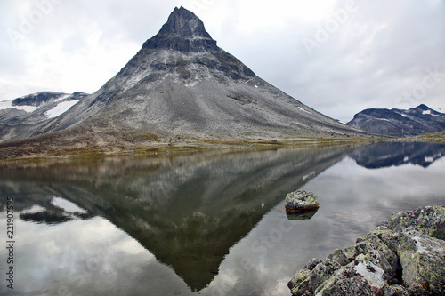 reflection of a large mountain in the lake