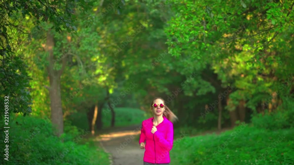 Girl runs through park Girl runs through park