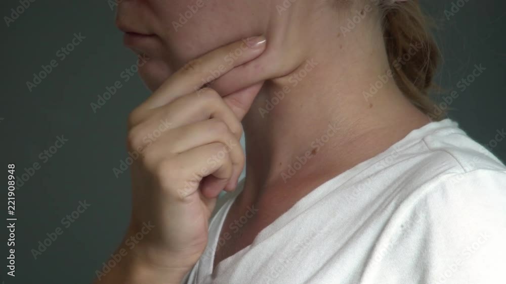 Young Caucasian Woman Examining Double Chin. Facial Line Correction Young Caucasian Woman Examining Double Chin. Facial Line Correction