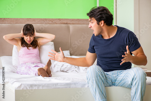 Woman and man in the bedroom during conflict