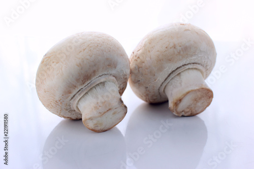 champignon mushrooms on a white background table, diet of healthy food,