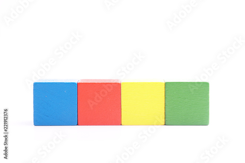 multi colored wooden block on white background