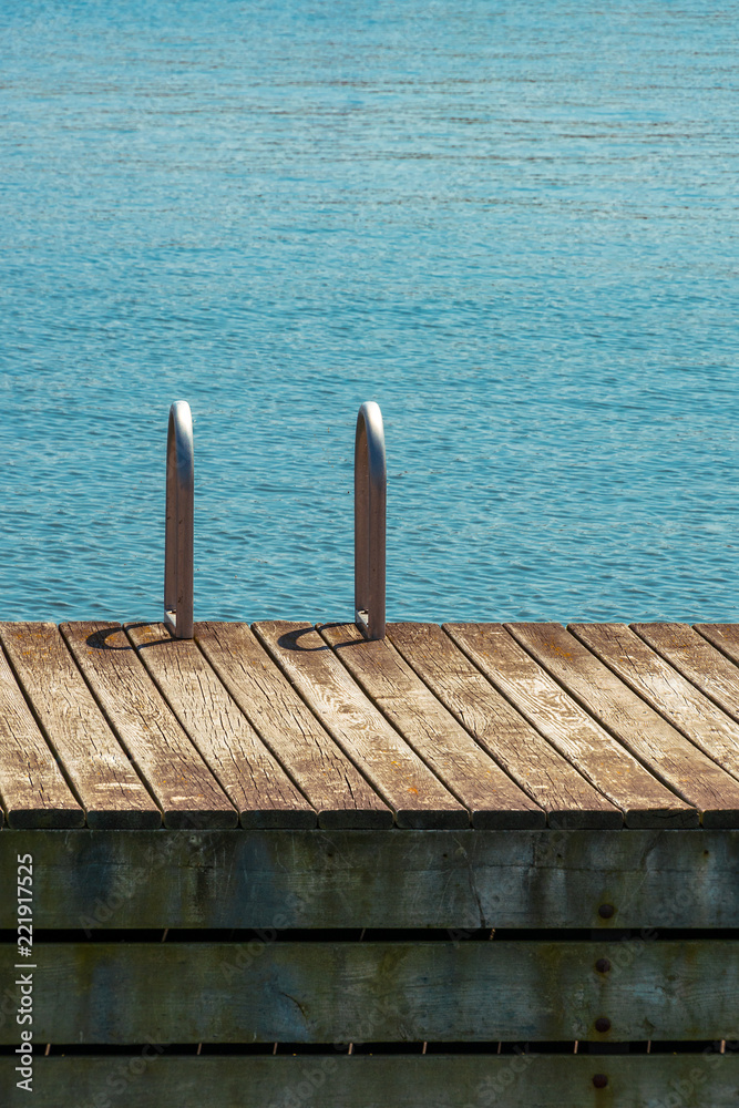 Fototapeta premium Empty dock, pier with ladder, concept, background, abstract & copy space