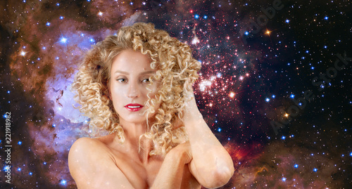 Leo Zodiac Sign on night sky background. Woman with wavy hair.