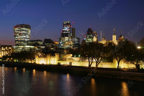 Skyscraper of London Business and Financial District with Modern Buildings Offices and Ancient Fort  at Twilight  View from Tower Bridge