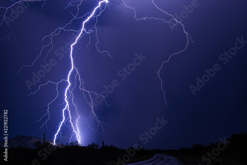 Lightning bolt strikes a hillside during a storm near Tucson, Arizona
