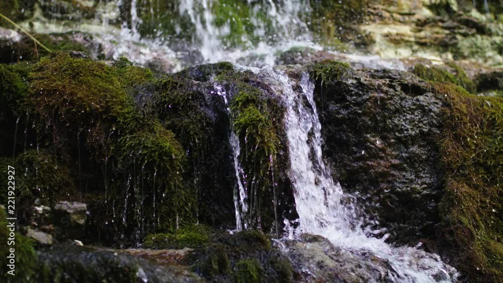 the water is flowing along the waterfall the water is flowing along the waterfall
