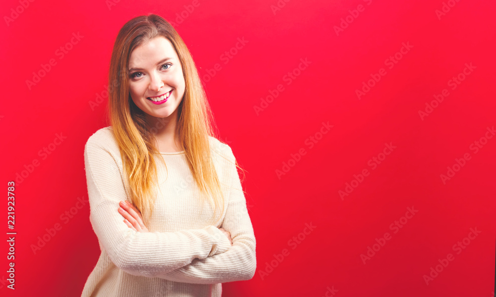 Obraz premium Happy young woman on a solid background