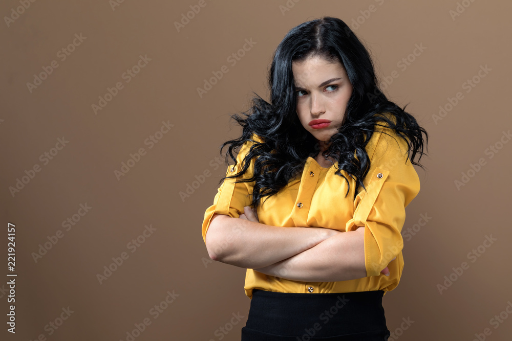 Angry young woman on a solid background Angry young woman on a solid background