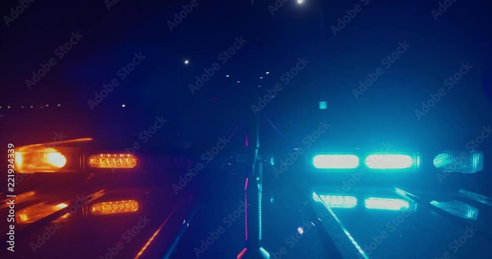 top view of police car emergency lights flashing driving at high speed