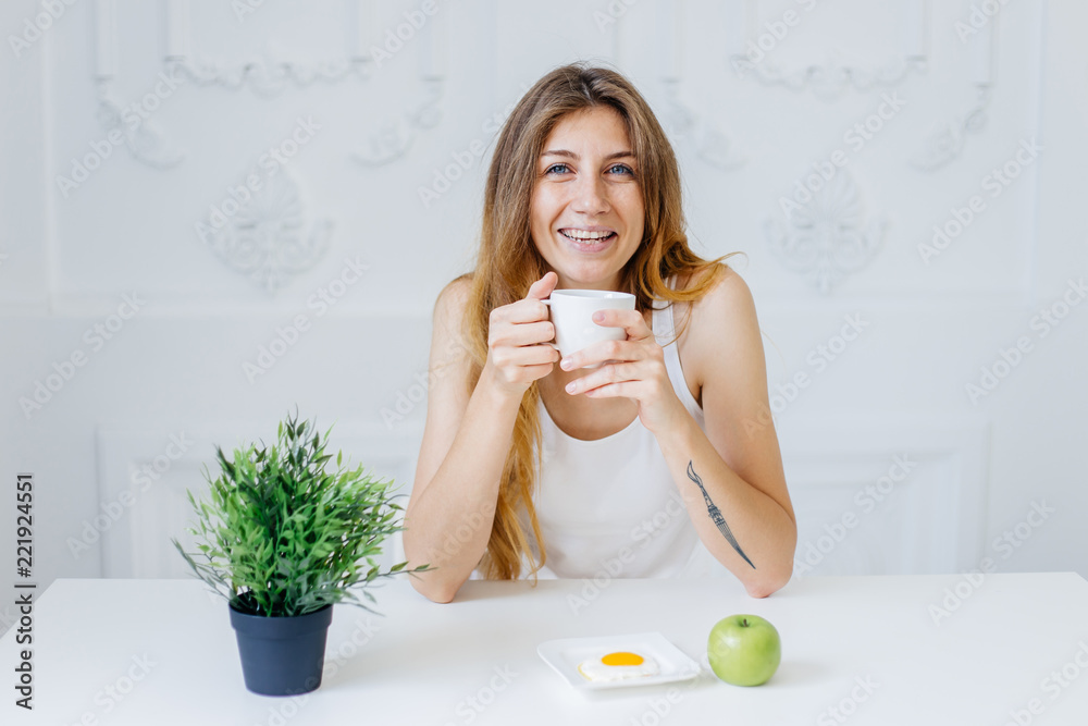 Young beautiful woman having breakfast in bed Young beautiful woman having breakfast in bed