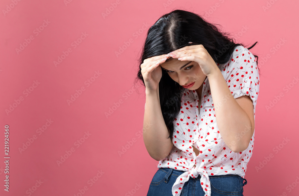 Worried young woman on a solid background Worried young woman on a solid background