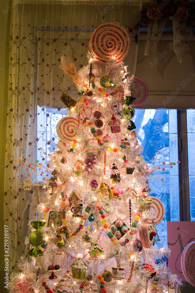 Naklejka premium White Christmas Tree in front of window