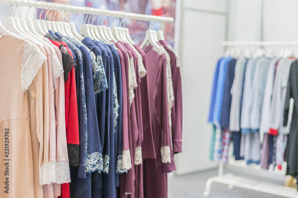 Clothing retails concept. Ladies pajamas on hangers in clothes store.  Pajama in shop. Advertise, Sale, Fashion concept.Shopping, fashion clothes  style and people concept Stock Photo | Adobe Stock