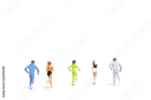 Miniature people running on white background , Healthy lifestyle and sport concepts. 