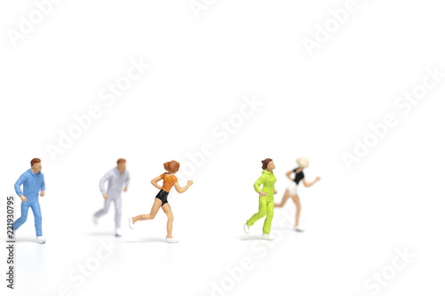 Miniature people running on white background   Healthy lifestyle and sport concepts.  