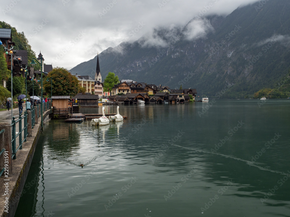 Fototapeta premium Hallstatt village with fog and clouds, World Heritage, Hallstatt mountain village in the Austrian Alps at beautiful light in Summer, Hallstatt, Austria. August, 2018