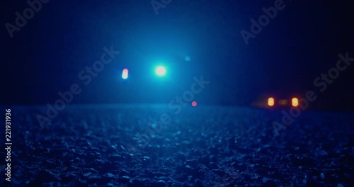 police suv on side of road near country flashing lights parked focus on ground