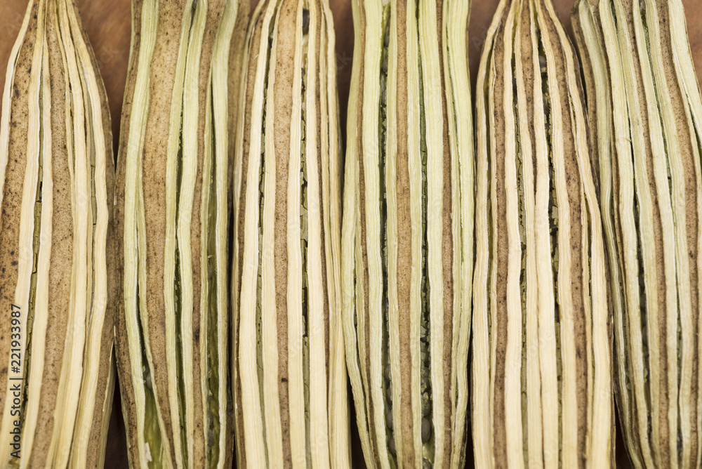 Fototapeta premium Close up of dried okras on the wood dish.