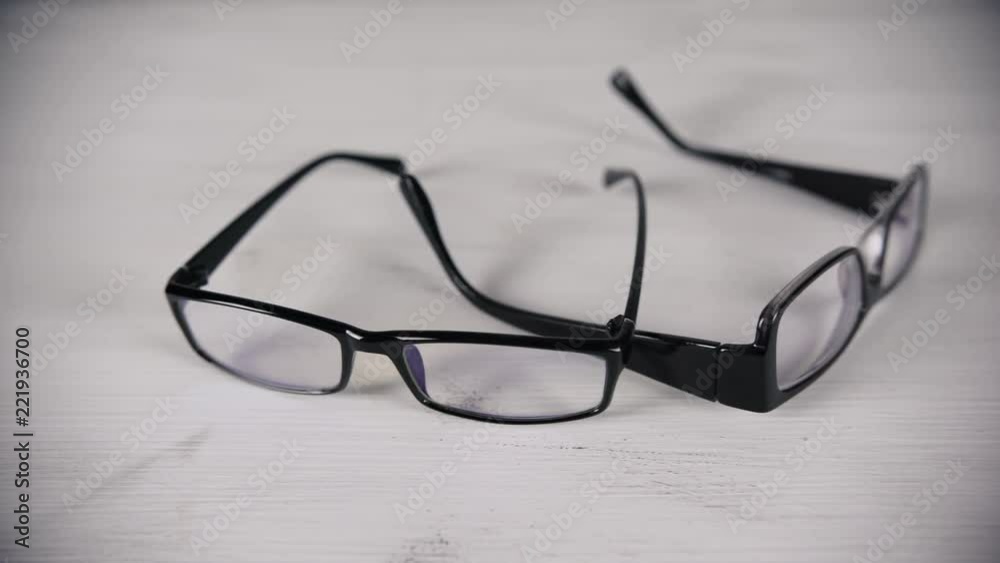 Front view of reading glasses on white table. Front view of reading glasses on white table.