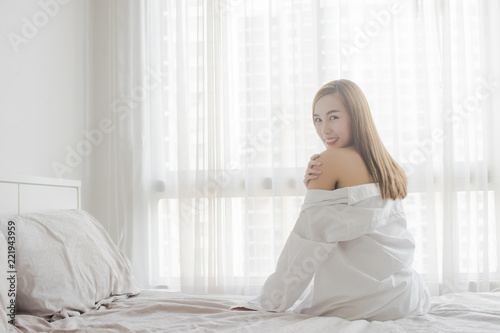 Sexy young Asian woman sitting in the morning