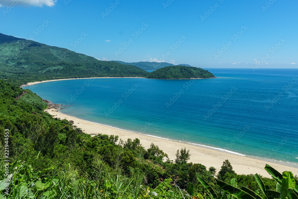 Faraway view of beautiful, clean, secluded beach in Vietnam on a sunny day