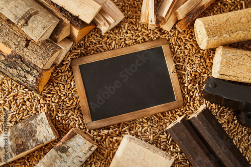 Overhead view of blackboard surrounded by logs photo