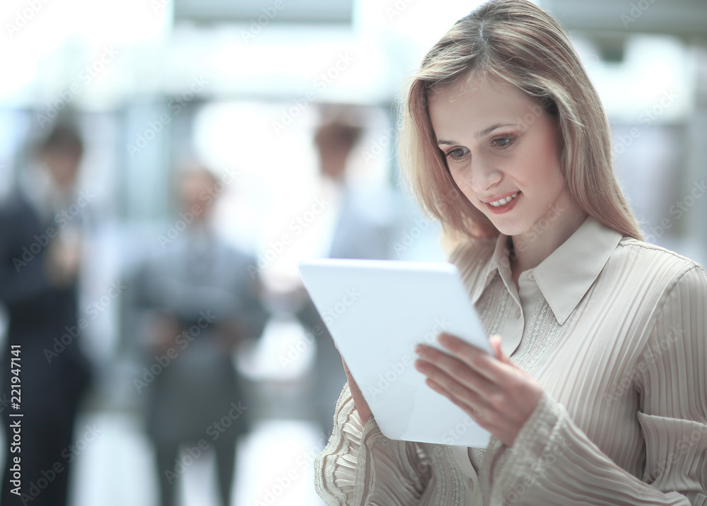 close up.business woman with digital tablet on blurred office background. photo with copy space
